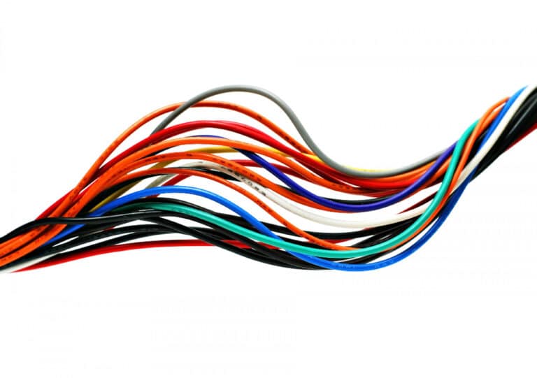 an assortment of colored wires on a white background
